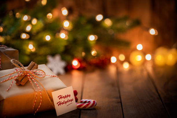 istock Brown Christmas gift box with Happy Holidays tag. 1676541274