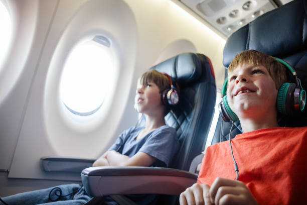 istock Brothers Riding Airplane Together 1676542348
