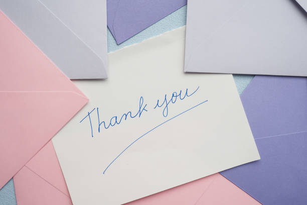 istock thank you message and envelope on wooden table 1676560918