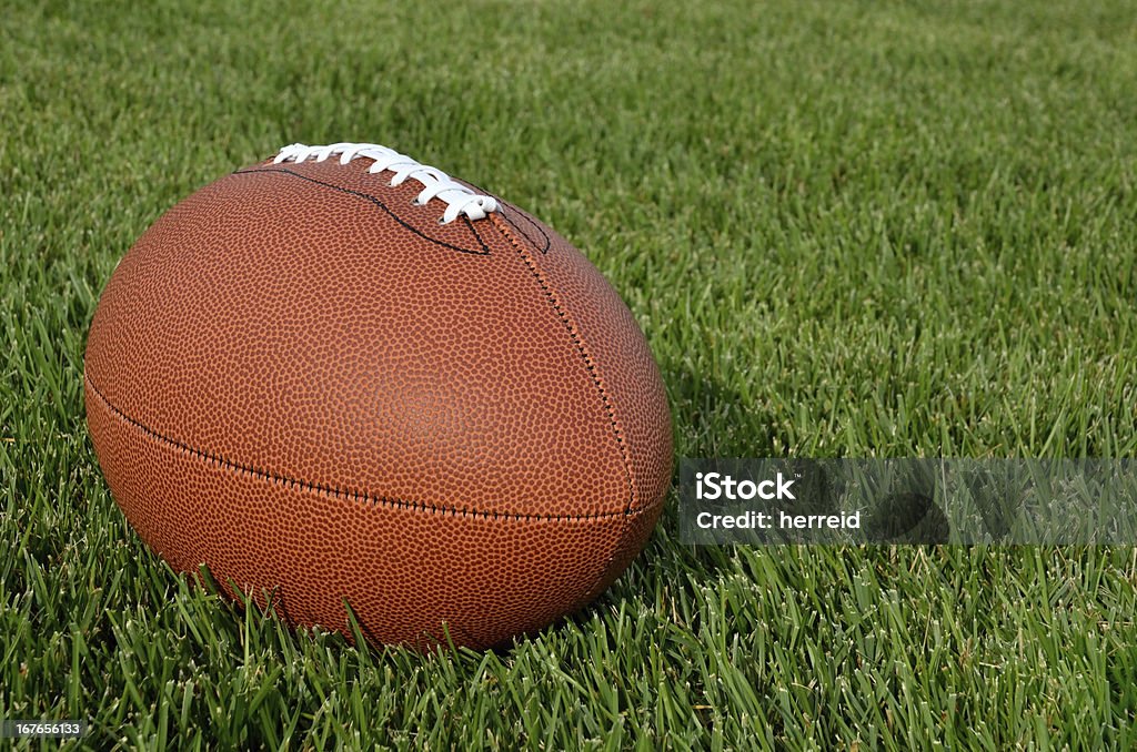 American Football on Grass Field - Foto de stock de Aire libre libre de derechos