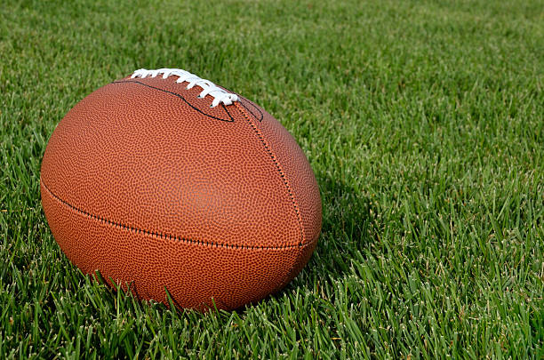 istock American Football on Grass Field 167656133