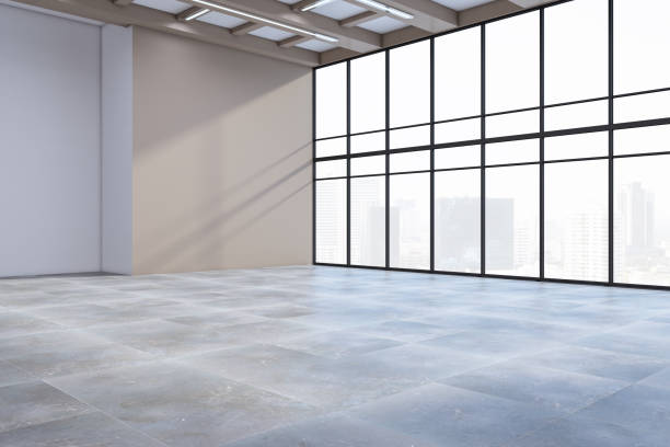 istock Clean empty concrete office premises interior with panoramic windows, city view, shadows and mock up place on wall. 3D Rendering. 1676562981