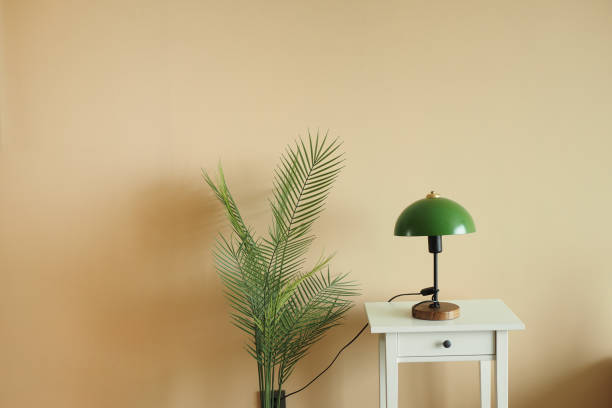 istock a table lamp in home against light orange wall 1676584925