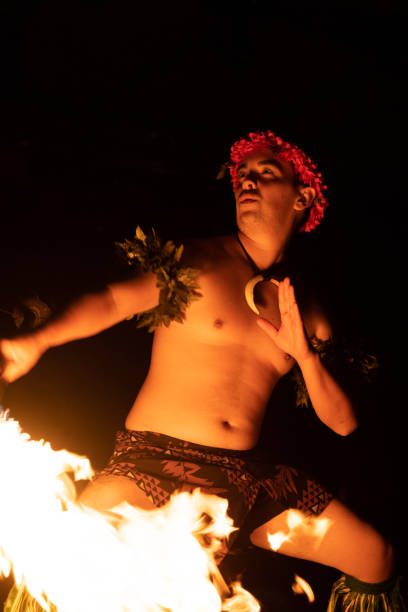 istock Hawaiian male dancer with torch in hands. 1676608505