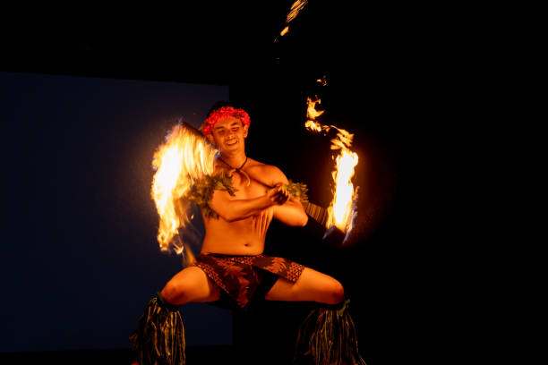A Muscled Man Shoots a Flamethrower in a Desert