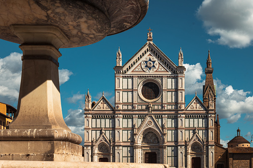 The Basilica of Santa Croce and the fountain in Santa Croce Square in Florence, Italy