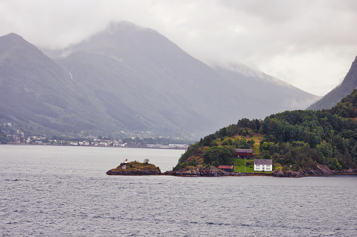 Lonely isolated house sitting Geirangerfjorden in Norway
