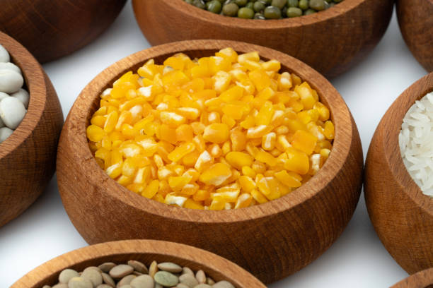 Wooden bowl full of porridge, cereals, lentils, peas and beans.