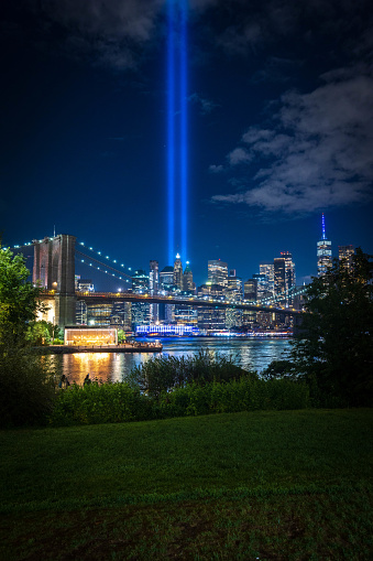 The Tribute in Light 9/11 memorial shot from Brooklyn Bridge Park. New York City