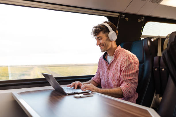 istock Young Man in Smart-Casual Attire Travels by Train 1676731424