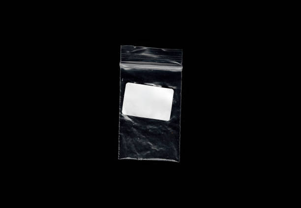This high-resolution photograph features the detailed texture of a wrinkled plastic baggie, set against a black background that is easily removable or maskable. The image highlights the complex patterns and shadows created by the wrinkles in the plastic, providing a versatile texture layer for designers and artists. The contrast between the translucent plastic and the dark background enhances the texture's visibility, making it suitable for a wide range of creative projects, including graphic design, digital art, and visual effects. This photograph is ideal for professionals looking for high-quality texture layers that can be easily integrated into their work, offering both aesthetic depth and technical adaptability.