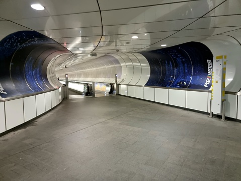 Rotterdam Wilhelminaplein metro station. The image shows a Moving walkways between station and theater. The Rotterdam Metro consists of 5 lines with 70 stations.