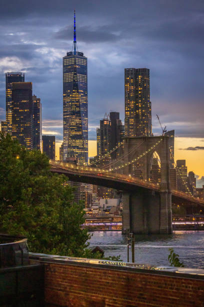 istock Freedom Tower and Brooklyn Bridge Through an Arch 1676826120