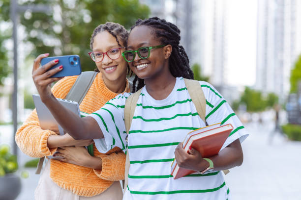 istock Two young female students taking a selfie together 1676826655