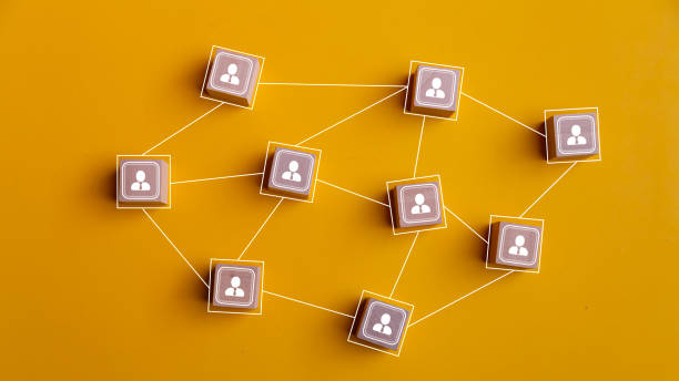 istock Wooden blocks connected together on a yellow background. Teamwork, network, and community concept. 1676852831