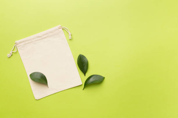 istock Small eco sack on color background. Top view. 1676855401