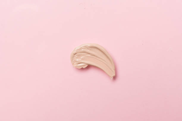 istock Foundation smudge on color background, top view 1676859404