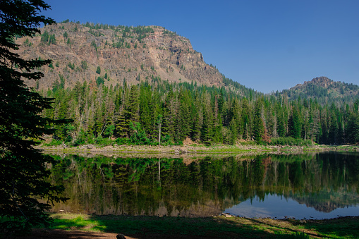 Strawberry Lake in the Strawberry Mountain Wilderness of Oregon. This peaceful lake is only reached by hiking through a desert forest setting in the Cascade Mountain Range.