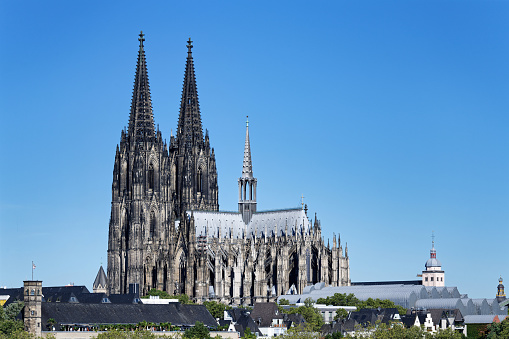 the imposing building of the cologne cathedral towers high above the old town of cologne