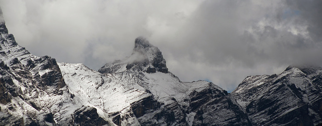 view of a mountain peak after a blizzard in summer