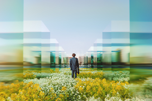 Businessman in VR environment walking towards the city, 3D generated image.