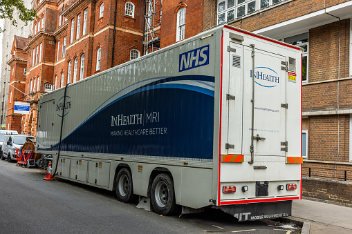 A mobile MRI scanner in front of a hospital in London.  Shot on 11 September 2023 at Queens Square in Central London.