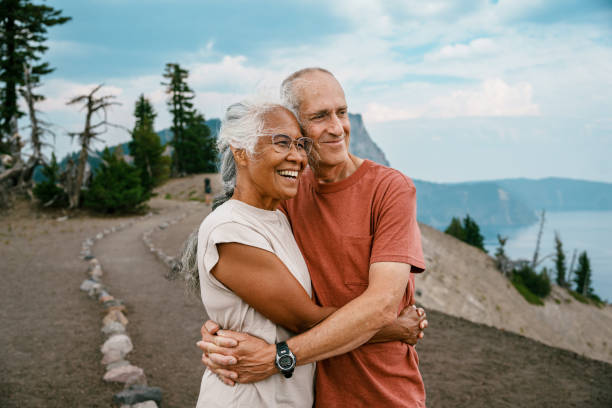 istock Active senior couple enjoying scenic view while on a hike 1677022593