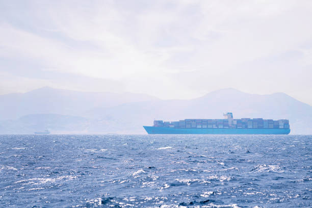 istock cargo ship sailing among sea mist near the coast 1677024365