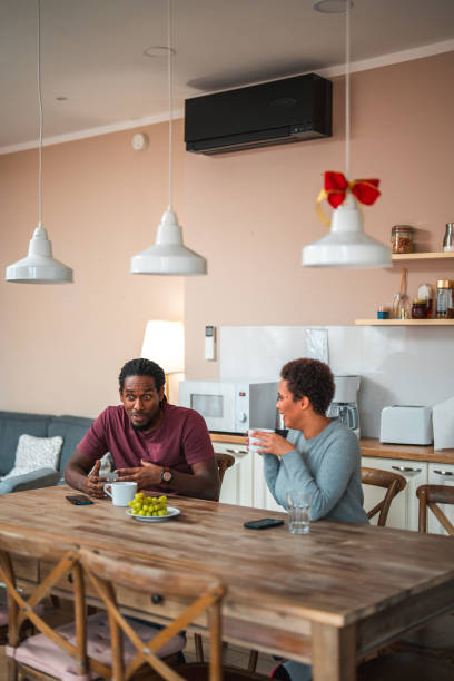 istock Lovely Diverse Couple  Hanging Out In A Kitchen 1677063984