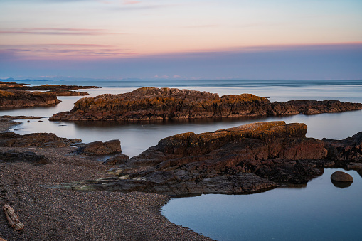 Sunset on Dallas Road in Victoria, BC, with tidal pools.