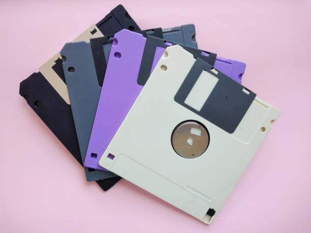 istock Colorful floppy disks or Diskette on pink background. 1677104325