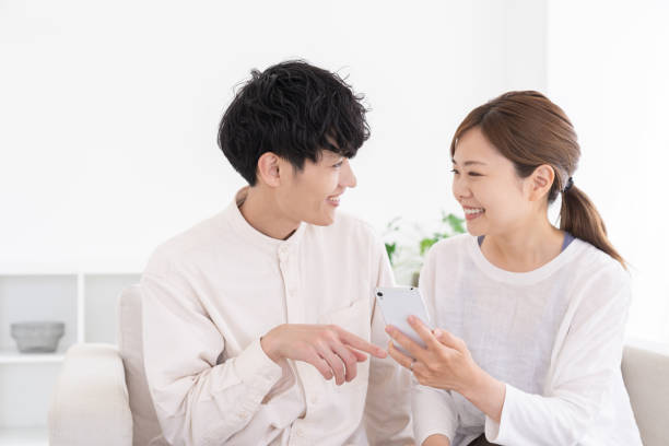 couple at modern home , smart phone stock photo