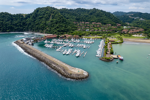 Beautiful aerial view of the Los Sueños Marina full with yachts and boats in Herradura Beach - Costa Rica