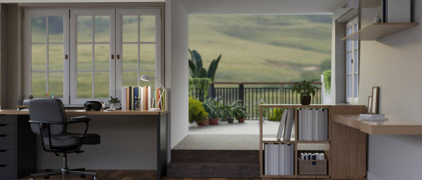 istock A modern and comfortable home workspace or office with a desk, a balcony with beautiful nature view. 1677205943