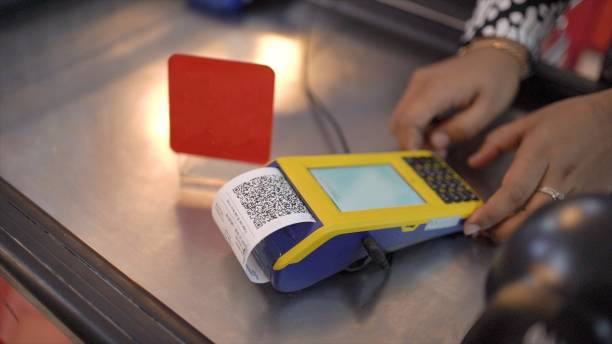 istock Hand uses mobile phone app to scan a QR code in a store and pay for goods and services. Making and accepting payment, transfers and pay invoices. Services accept digital payments without money 1677231626
