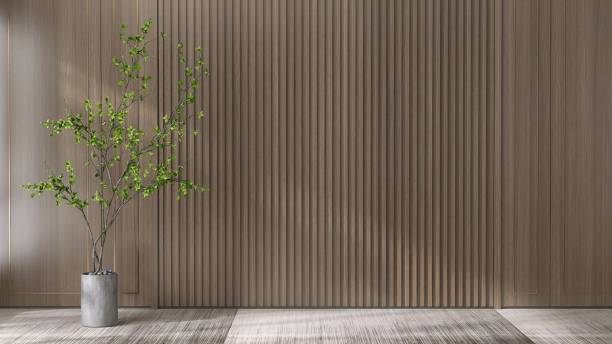 istock Green tree in gray pot in sunlight from window, shadow on blank wood panelling wall, carpet floor 1677261400