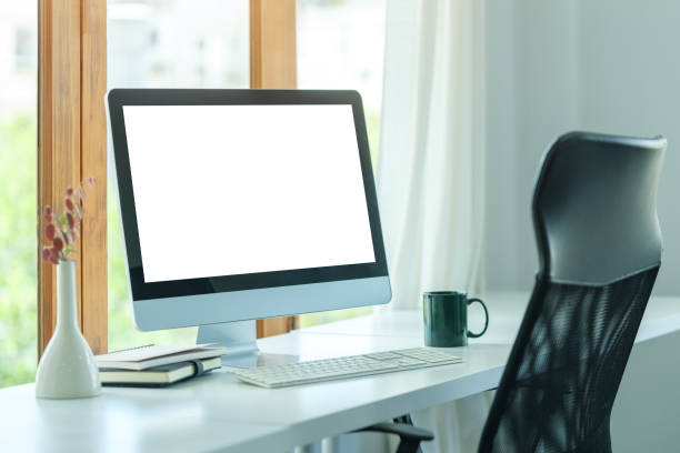istock Comfortable home office. Computer, stationery and potted plant on white table. 1677268246