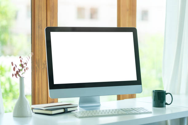 istock Minimal workplace. Computer monitor with white screen, coffee cup and books on white table. 1677268248