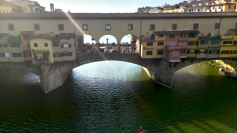 Aerial view of ponte vecchio bridge in Florence city, Florence bridge and river, Historically and Culturally Rich Italian Town Florence, Firenze - Aerial view of the city of Florence, Popular tourist destination in the world