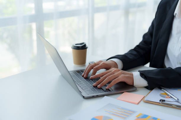 istock Woman hand who are actively typing and concentrate on work using laptop computer at the office. 1677285490