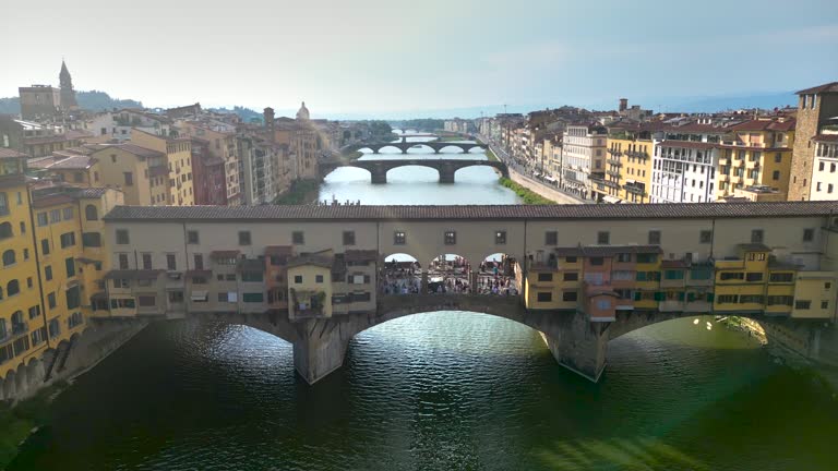 Aerial view of ponte vecchio bridge in Florence city, Florence bridge and river, Historically and Culturally Rich Italian Town Florence, Firenze - Aerial view of the city of Florence, Popular tourist destination in the world