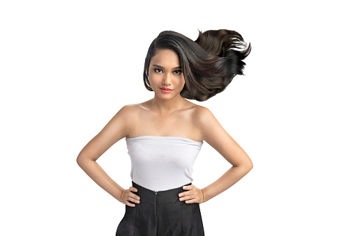 Portrait of an Asian beautiful woman with long hair isolated over white background