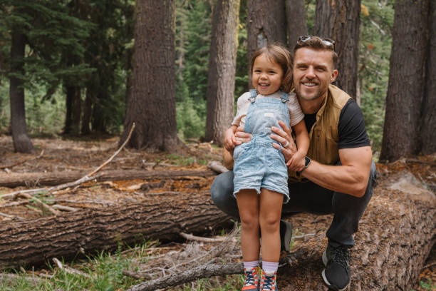 istock Happy dad and daughter spending time together in nature 1677397549