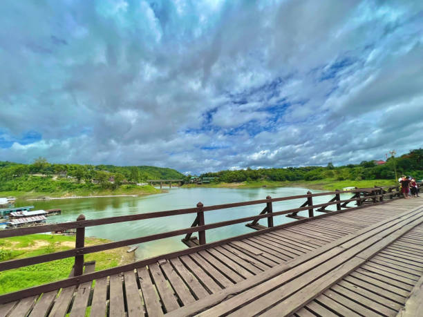 istock wooden bridge over the river 1677397557