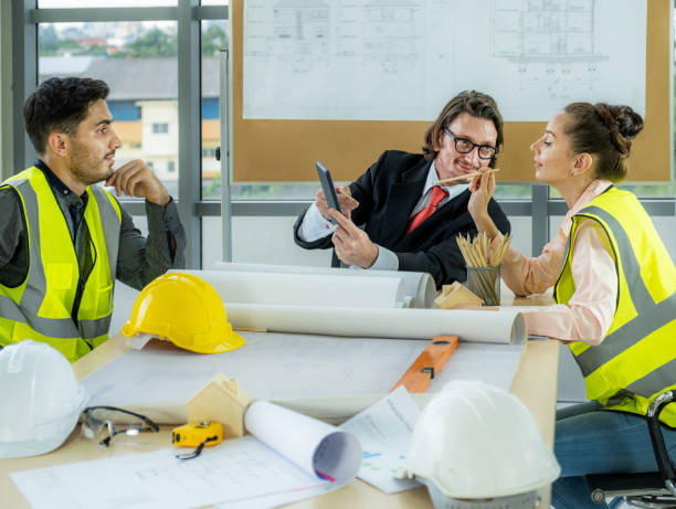 istock Engineer team is meeting to inspect the construction blueprint drawings, work plan and distribute work before starting the building 1677452840