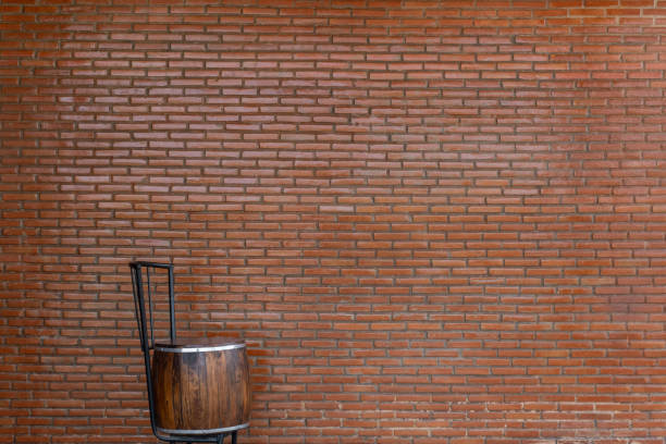 Chair on Red brick wall background for your creative imagination with copy space.