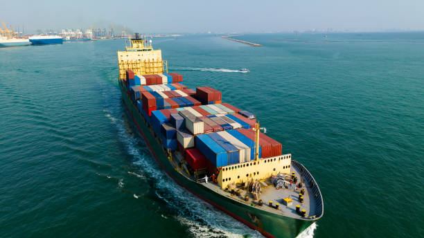 istock cargo logistic container ship sailing in sea to import export goods and distributing products to dealer and consumers worldwide, by container ship Transport, commercial port background, 1677465731