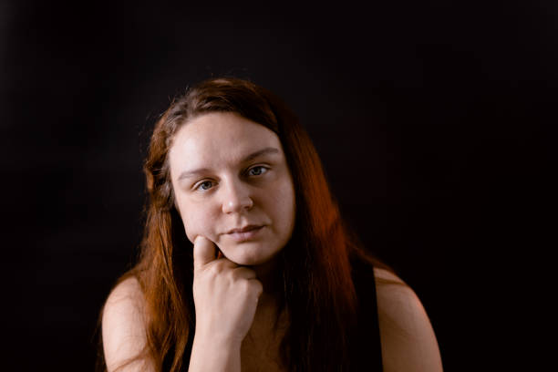istock Unhappy young woman with empty glance. Thoughtful devastated person concerned with problems. Hopelessness and despair. 1677476660