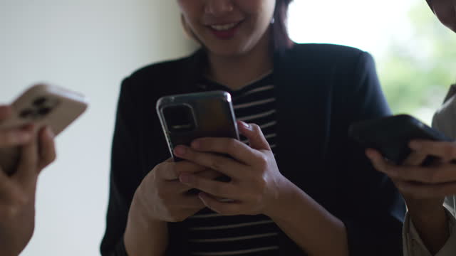 Asian people connecting to internet video chat using smartphone
