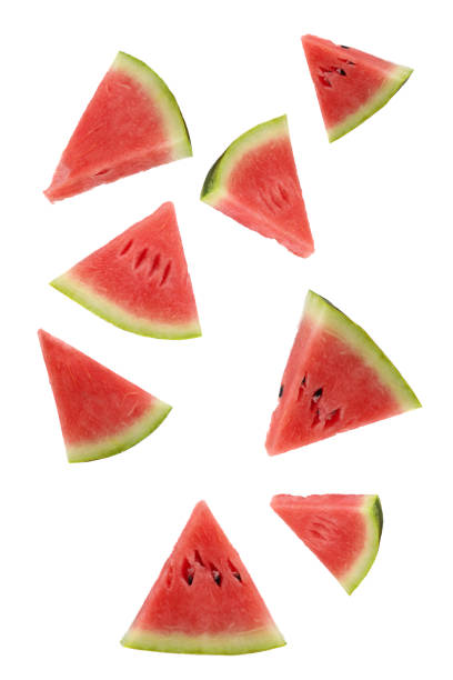 istock Triangular slices of ripe watermelon floating on a white background. 1677489335